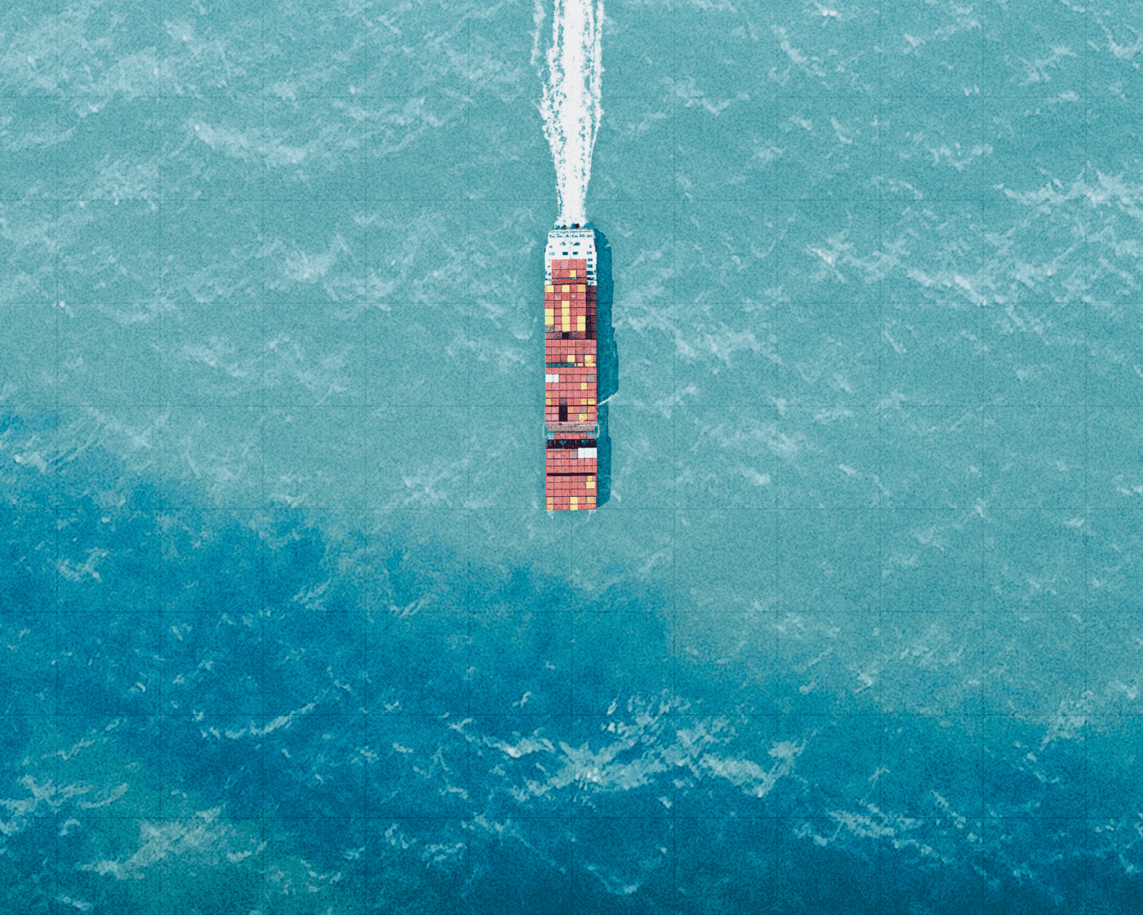Aerial view of a container ship at sea.